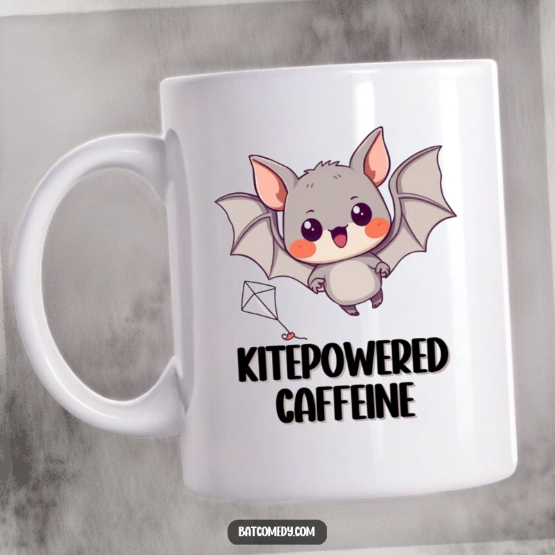 Funny mug showing a black bat with wide, excited eyes struggling to fly a small, colorful kite.