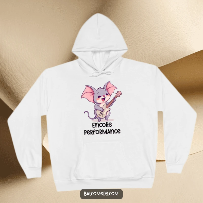 Funny hoodie featuring a kawaii bat enthusiastically playing a small guitar, perfect for music lovers who enjoy cozy rock and roll vibes.