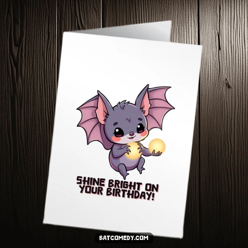 Funny Free Printable Birthday Card: A bat holds a tiny, luminous orb in its claws, offering a wish of magical birthday joy.