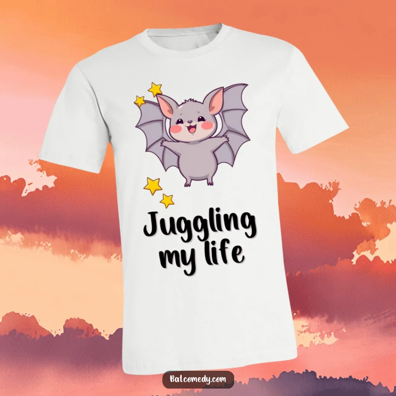 Funny t-shirt depicting a bat excitedly juggling three tiny stars with its wings, showcasing talent and playful energy.