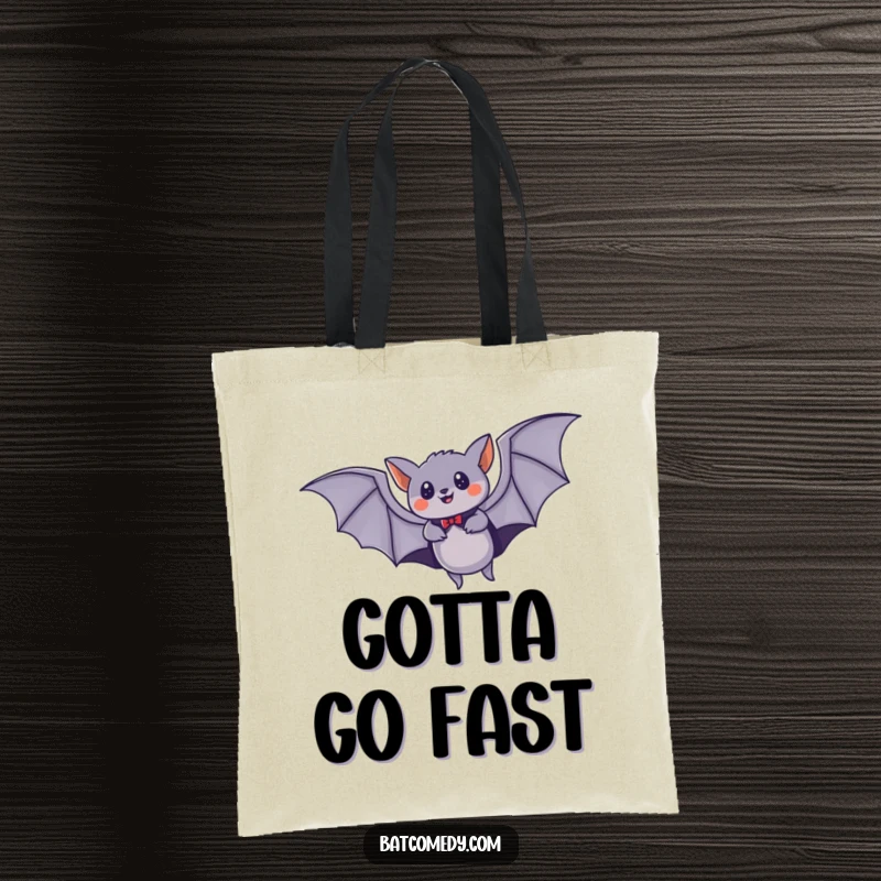 Funny tote bag with a stylized bat wearing a cape, flying at high speed through the night, a symbol of swiftness.